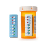 Take-n-Slide pill tracker, the medication tracker that is easily attached to a medication bottle