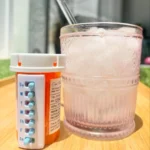 Take-n-Slide medication tracker and reminder white version on bottle