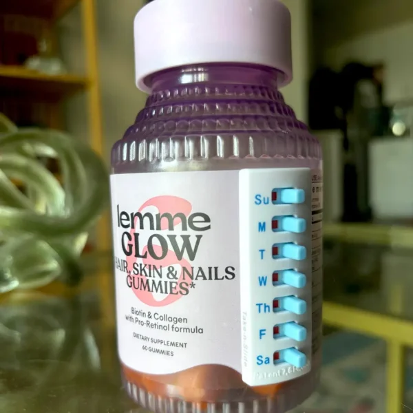 white take-n-slide stick on medication tracker placed on a vitamins bottle